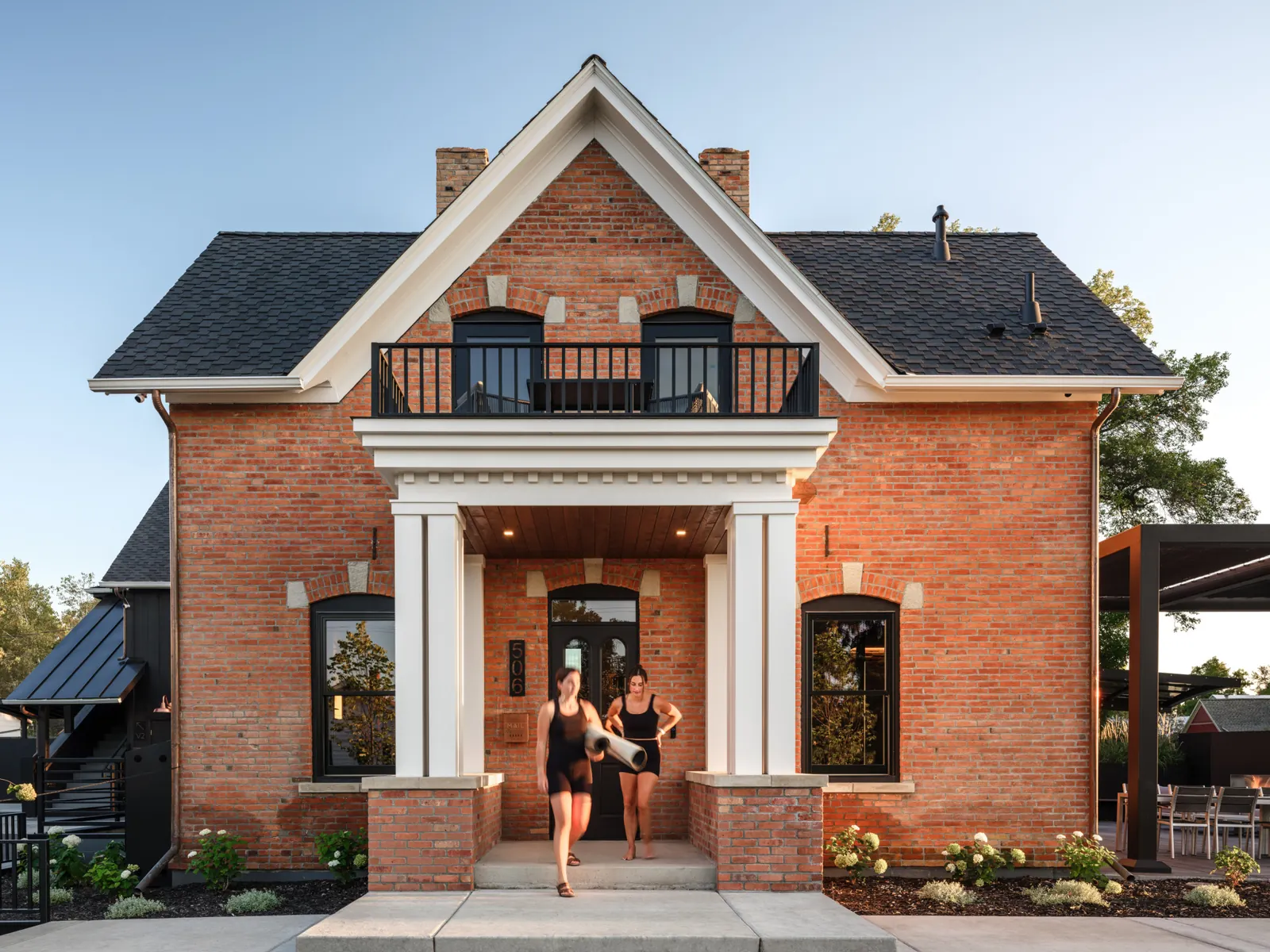 Guests leaving the historic Rouse House with yoga mats