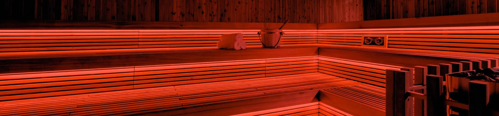 Warmly lit wood-lined sauna at Umvelt Bathhouse in downtown Bozeman